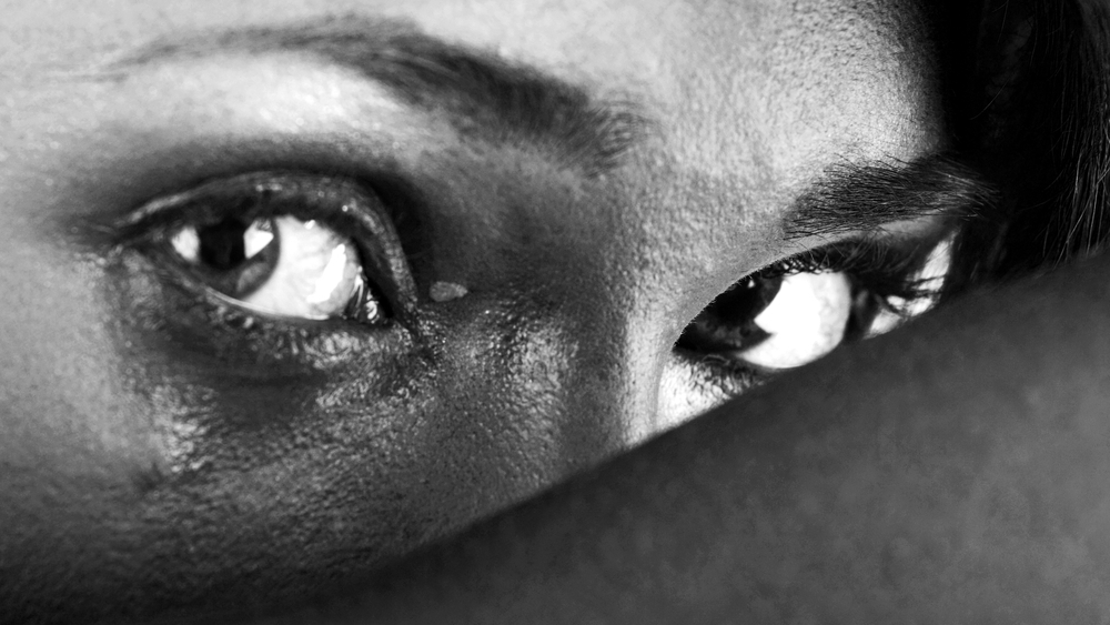 Close-up of a vulnerable woman's eyes, illustrating an emotionally abusive relationship